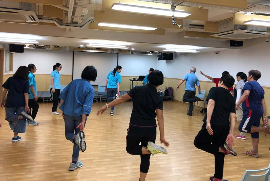 A group of people doing physiotherapy stretches